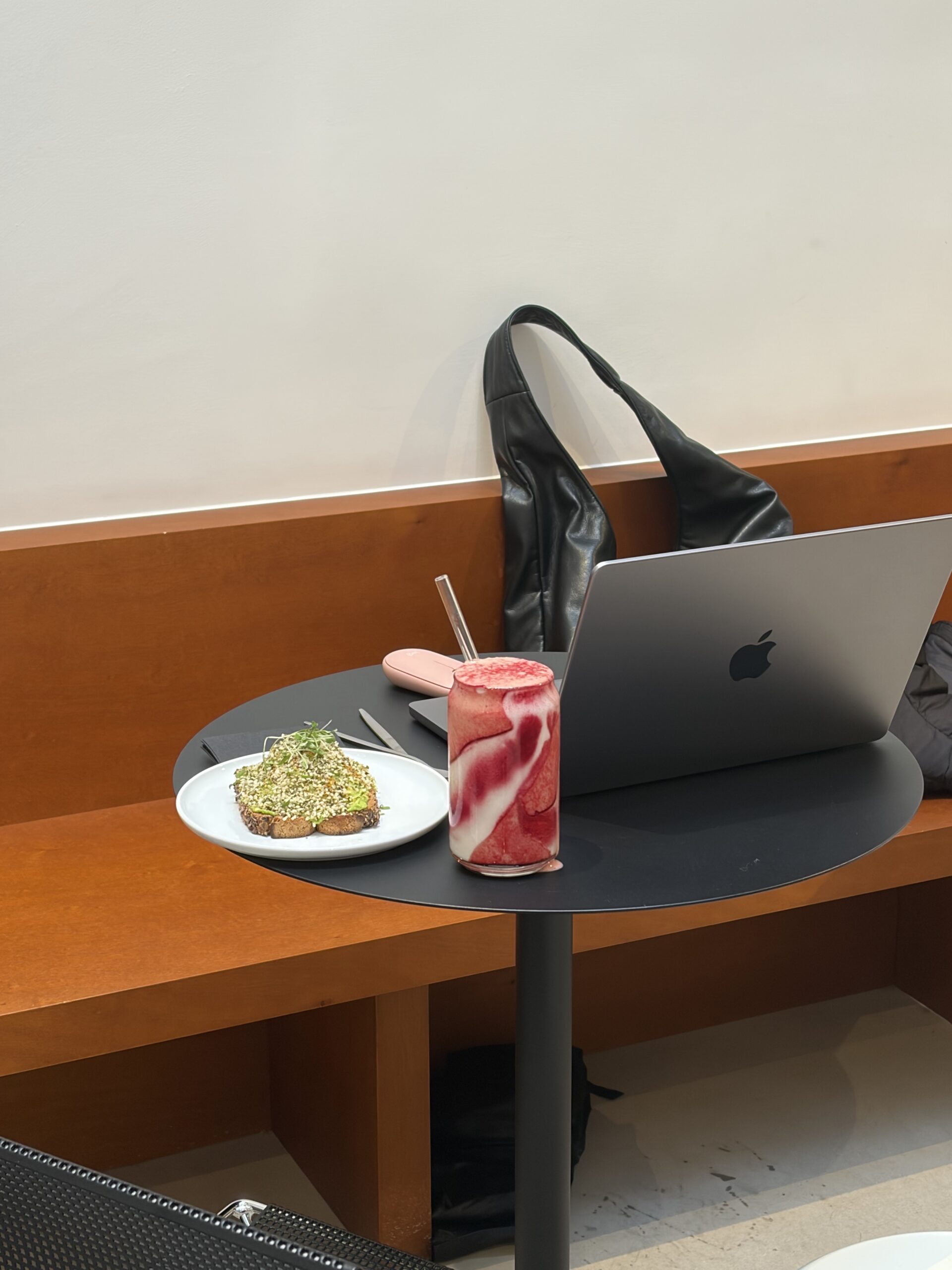 Founder of Seen & Shared Marketing, Sarah Price, sits at desk with pink smoothie and avocado toast while explaining How to Create CPG Content that Consumers Want to Share