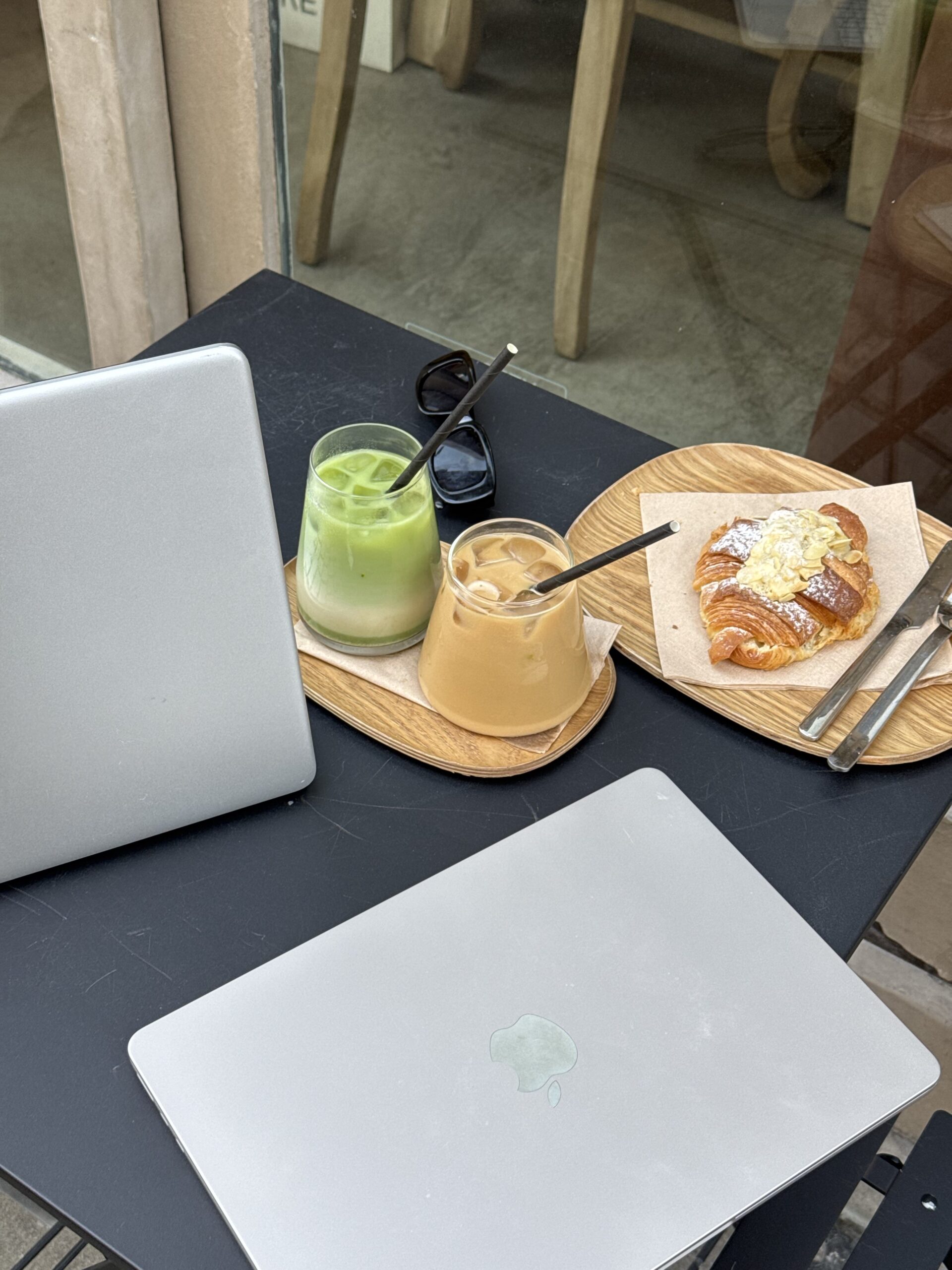 Founder of Seen & Shared Marketing, Sarah Price sits at desk with laptop and explains Why Your CPG Brand Feels Invisible on Social Media (And How to Fix It)